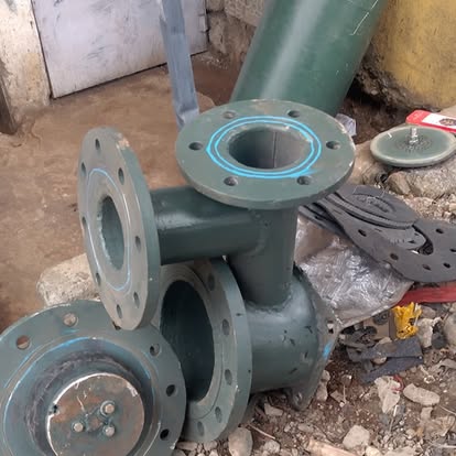 Green painted flanged fittings and gaskets ready for install