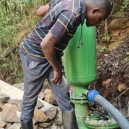 Technician checking a green hydram on site
